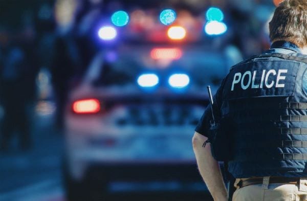 Police officer near a police car